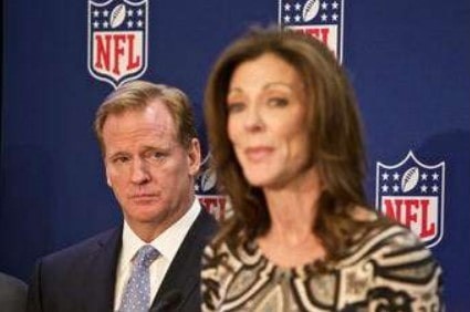 NFL commissioner Roger Goodell (l.) looks on as Dallas Cowboys Executive Vice President Charlotte Jones Anderson speaks at a press conference