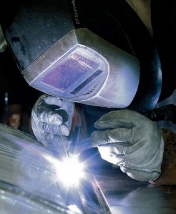 article-christian-science-monitor-school-is-a-factory-A-worker-welds-a-stainless-steel-tank