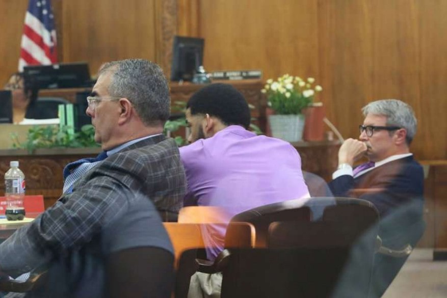 Dominique Heaggan-Brown, center, with his lawyers at the opening of his trial in Milwaukee on Tuesday in the killing of Sylville K. Smith. If convicted of first-degree reckless homicide, Mr. Heaggan-Brown, a former police officer, could face up to 60 years in prison